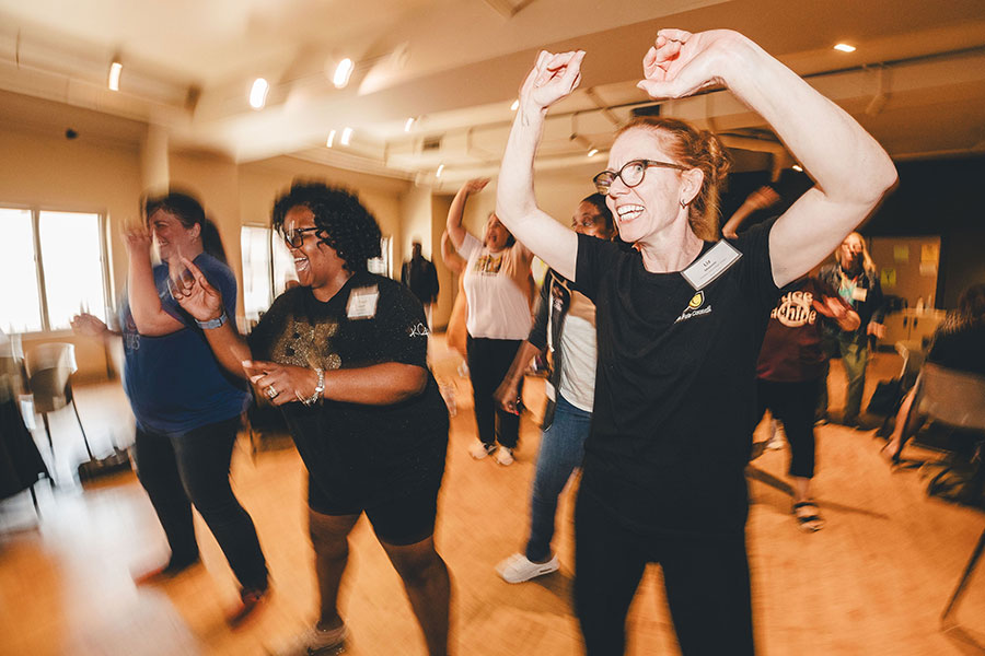 Teachers dancing and laughing