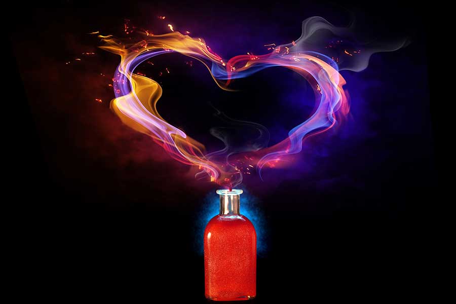 A potion bottle with a wisp of smoke emerging from the top and forming a heart.