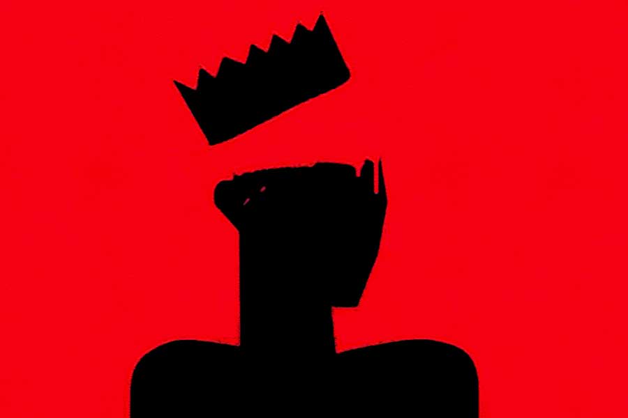 painted silhouette of a head with a crown rising above it against a red background